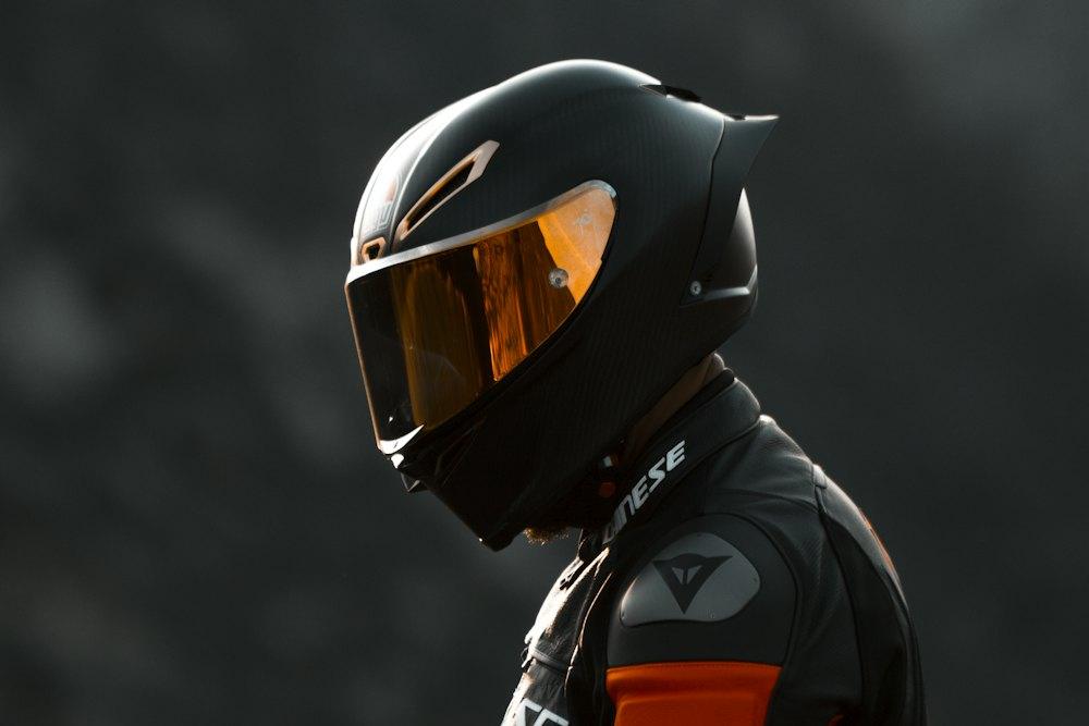 Full-face helmet with an orange visor